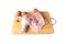 Fresh whole raw chicken with eggs, garlic and pepper on wooden