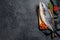 Fresh whole raw Japanese yellowtail. Fish Amberjack. Black background. Top view. Copy space