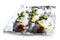 Fresh whole sea bass fish with lemon and herbs on foil isolated on a white