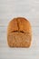 Fresh wholegrain bread on white wooden kitchen table