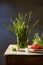 Fresh wild asparagus on wooden table with delicius plate of red currat