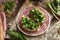 Fresh wild garlic or ramson leaves on slices of sourdough bread