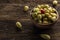 Fresh wild white strawberries on an old wooden table