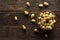 Fresh wild white strawberries on an old wooden table