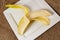 Fresh yellow bananas,wood,table,burlap cloth