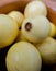 Fresh yellow guavas in a handmade clay bowl