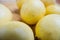 Fresh yellow guavas isolated on a wooden table