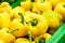 Fresh yellow organic sweet bell peppers on the farmer market on a tropical island Bali, Indonesia. Organic background.