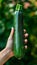 Fresh zucchini held in hand, selecting zucchinis on blurred background with copy space