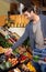 Only the freshest for him. a young man in a supermarket shopping for fresh produce.