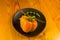 a freshest yellow paprika, bell pepper in ceramic plate