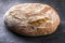 Freshly backed farmhouse bread on an old rustic board