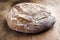 Freshly backed Farmhouse Bread on an old wooden board