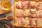 Freshly baked apple pie with nuts and ingredients on wooden table, flat lay