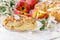 Freshly baked Apple pie on the table with apples, piece in plate