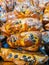 Freshly baked baked goods, quiche and raisin bun each individually wrapped