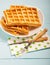 Freshly baked belgium waffles in plate. Breakfast concept with c