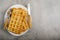 Freshly baked belgium waffles in plate with copy space. From top view