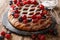 Freshly baked Berry pie with raspberries, blueberries and cherries close-up on a slate board. horizontal