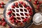 Freshly baked Berry pie with raspberries, blueberries and cherries close-up on a slate board. horizontal top view