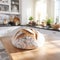 Freshly baked bread in bright modern kitchen closeup, rustic homemade loaf in natural light