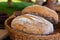 Freshly baked bread delicious round one-piece brown in a wicker basket eco rustic set design