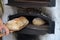 Freshly baked bread in old timey wood oven