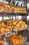 Freshly baked bread, shelves with buns on the display case. Quito, Ecuador
