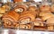 Freshly baked bread, shelves with sweet buns in the window. Confectionery. Quito, Ecuador