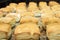 Freshly baked buns on a baking tray in a bakery