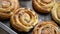 Freshly baked buns with cinnamon and spices. Close-up. Sweet baking concept