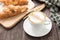 Freshly baked butter croissant on wooden background