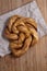 Freshly baked Cardamom Bun twist on paper bag