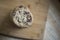 Freshly baked chocolate chip cookies stacked on cutting board with shallow focus