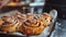 Freshly baked cinnamon buns with spices and cocoa filling on parchment paper. Top view. Sweet Homemade Pastry christmas baking.