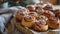 Freshly baked cinnamon buns with spices and cocoa filling on parchment paper. Top view. Sweet Homemade Pastry christmas baking.