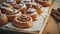 Freshly baked cinnamon buns with spices and cocoa filling on parchment paper. Top view. Sweet Homemade Pastry christmas baking.