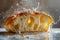 Freshly Baked Croissant with Golden Crust Splashed by Water Droplets on Wooden Surface in High Speed Photography