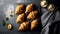 Freshly baked croissants on cooling rack over dark stone background. Top view, flat lay