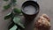 Freshly baked croissants, mint leaves and cup of coffee on wooden board, top view, selective focus