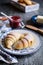 Freshly baked croissants served with raspberry jam and butter