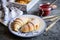 Freshly baked croissants served with raspberry jam and butter