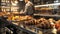 Freshly baked croissants on a tray with diced mango on a wooden counter in a bakery