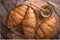 Freshly baked croissants on wooden boards, with wheat eart.