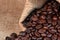 Freshly baked  dried coffee beans on background