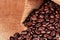 Freshly baked  dried coffee beans on background