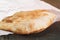 Freshly baked flat bread on wood table