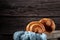 Freshly baked fragrant croissants on a wooden background