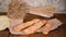 Freshly baked French baguettes on wooden table.