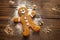 Freshly baked gingerbread man sitting on the kitchen table. Conceptual Christmas illustration. Generative AI